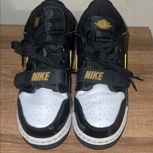 Nike Kids Black and White Sneakers with Gold Accents